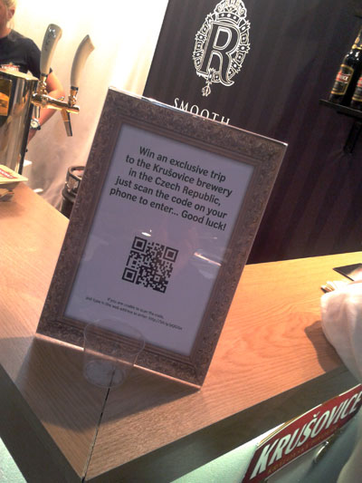 Krusovich sign at an event with QR code